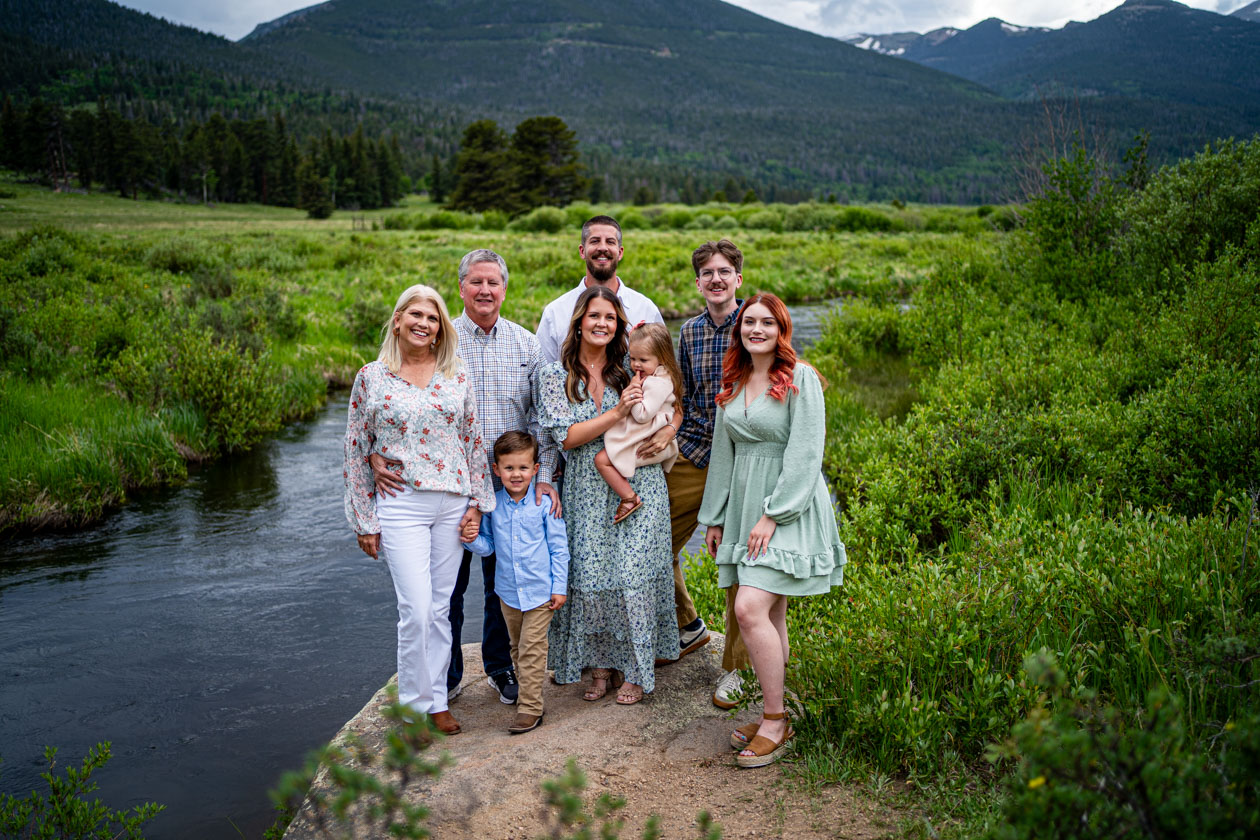 Extended family together in an open meadow in Rocky Mountain National Park, Colorado