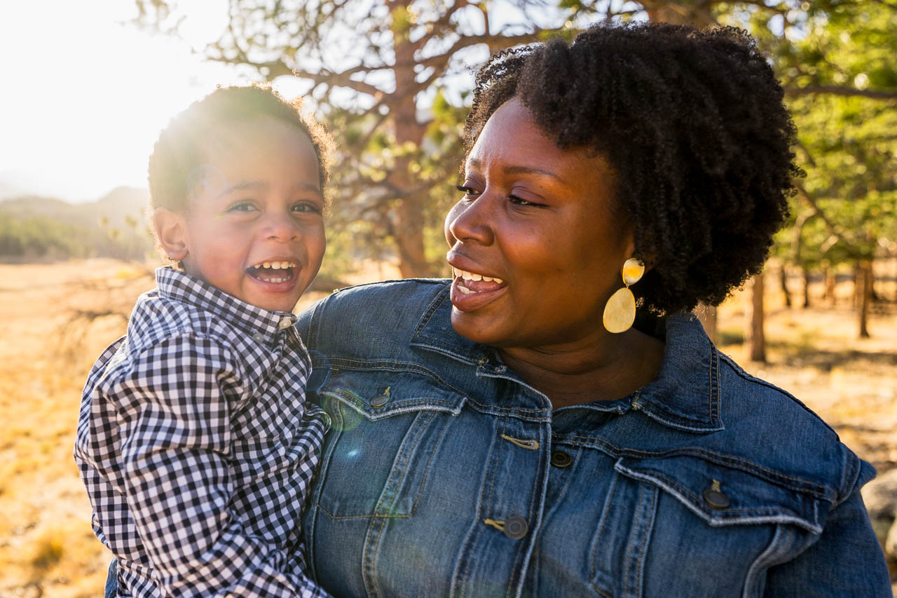 Candid family moment during sunset in Rocky Mountain National Park, photographed by Estes Park Family Photographer, Joe Pyle