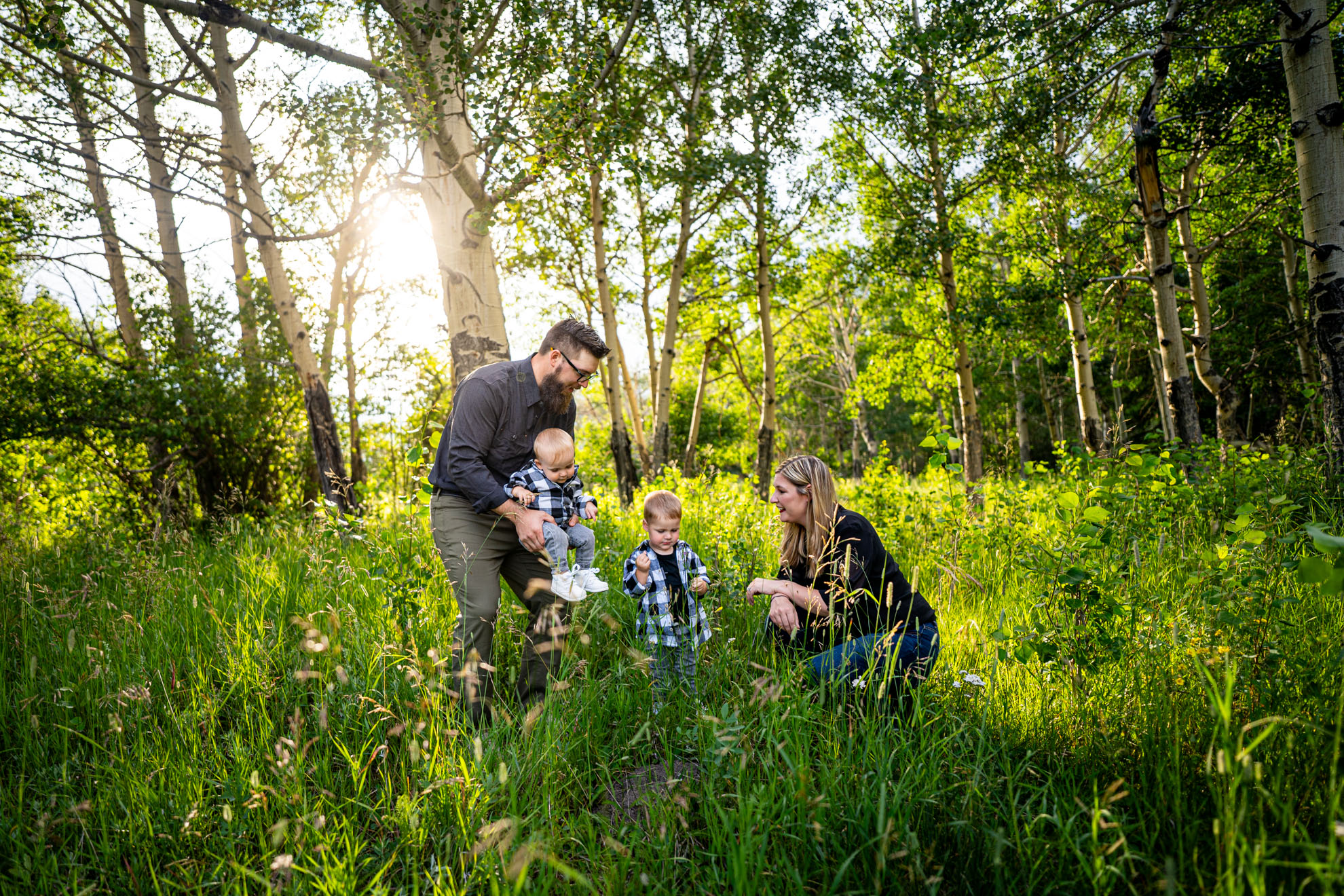 Candid family moment during sunset in Rocky Mountain National Park, photographed by Estes Park family photographer Joe Pyle